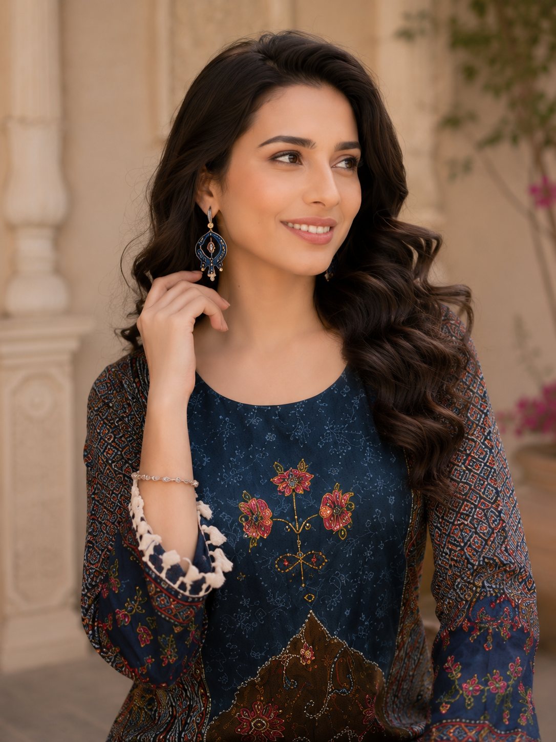 Teal Ajrakh Coord Set — close-up of teal yoke with floral embroidery and tassel cuffs