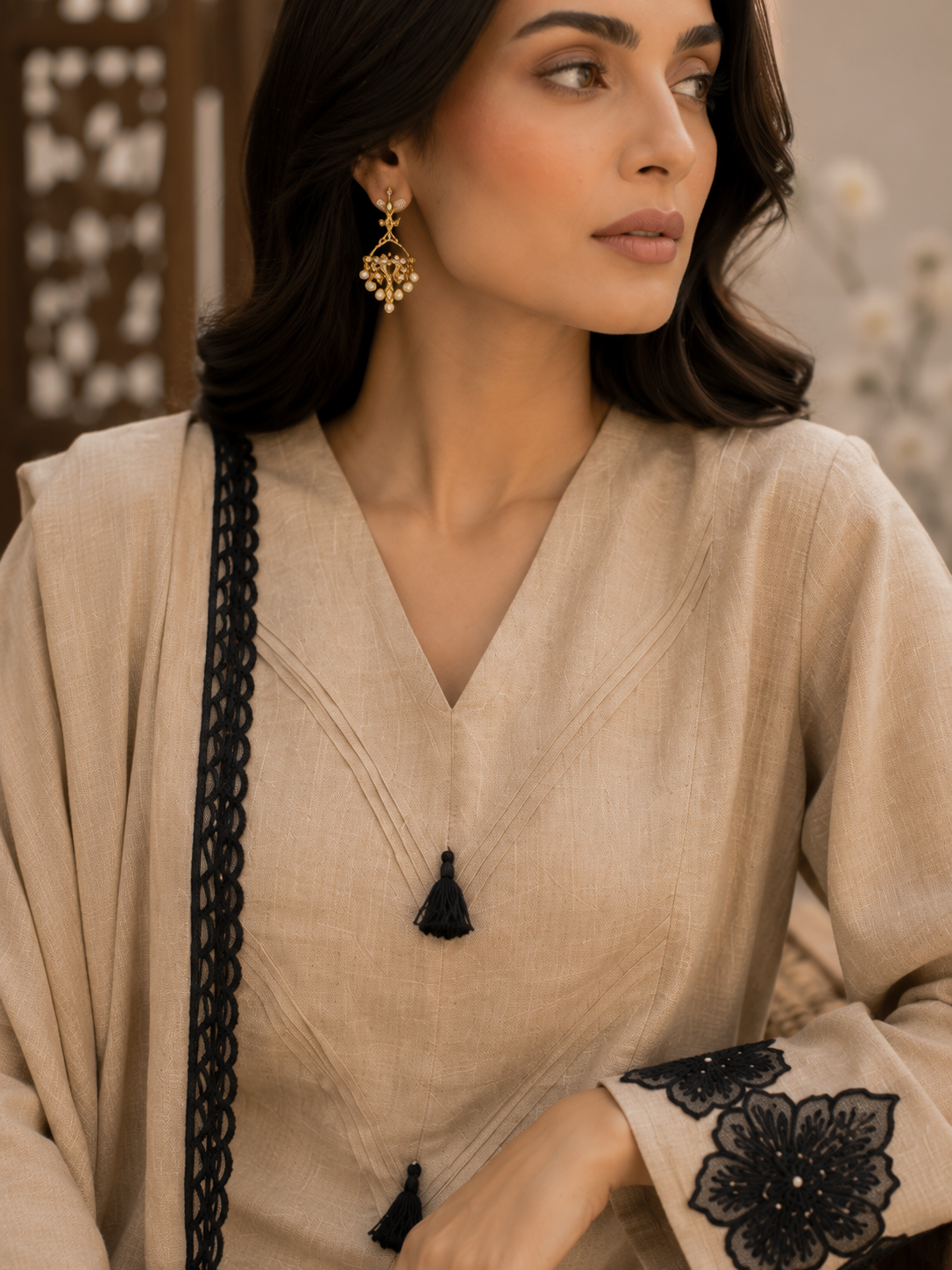 Beige eplic Pakistani kurta set - seated close-up